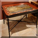 F25. Painted tole tray table with palace scene. 21”h x 29.5”w x 22.5”d 